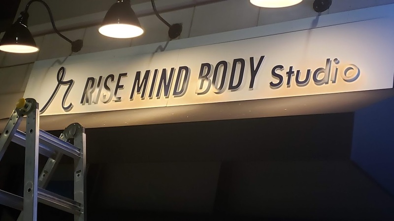 Rise Mind & Body Studio overhead sign