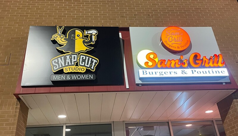 Outdoor commercial signs for Cambridge businesses on Hespeler Road